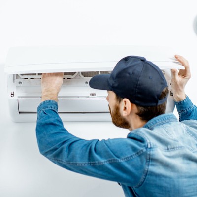 maintenance man fixing ac