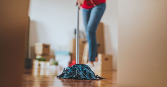 a person mopping an apartment