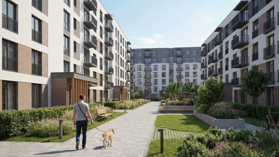 Man walking his dog around an apartment complex