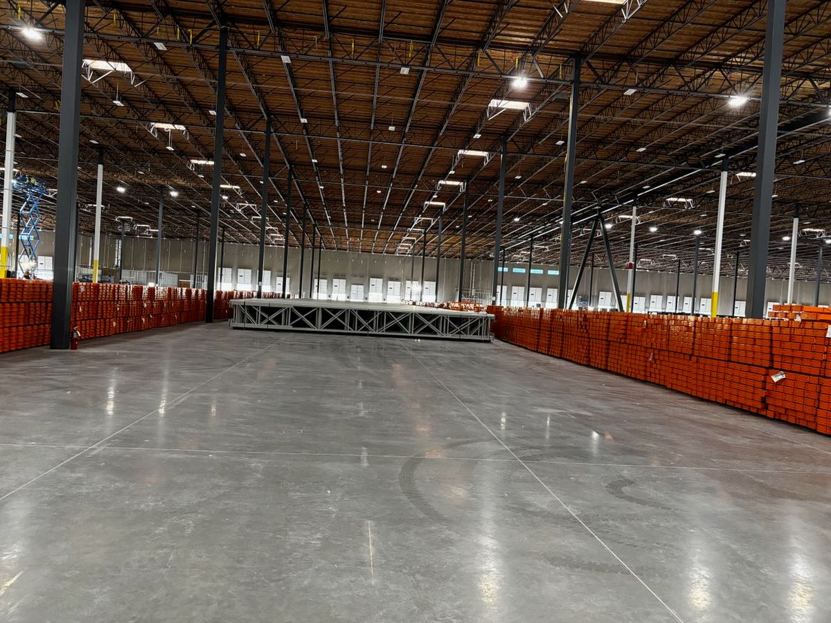 Large quantities of beams and structural components organized for safe, efficient installation across a major warehouse project. High-Volume Component Preparation