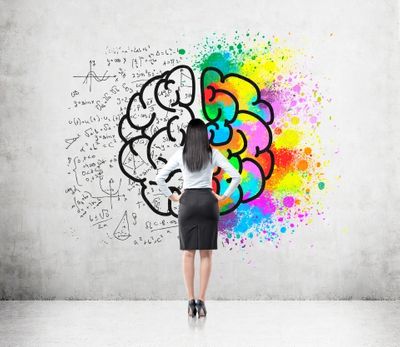 a business woman standing in front of a mind with math and colors around it