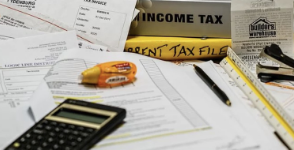 Tax documents, books and a calculator
