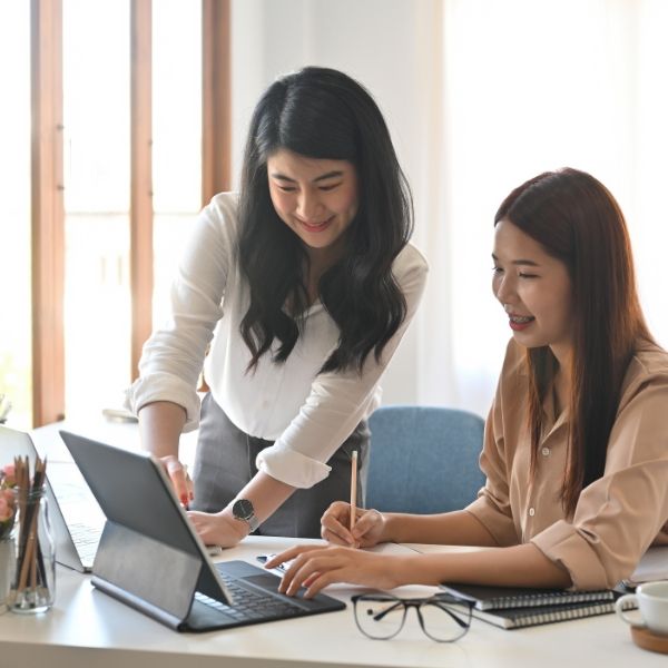 Two coworkers working at a desk