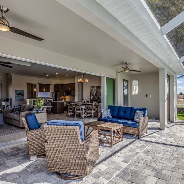 outdoor living area with large open door to interior