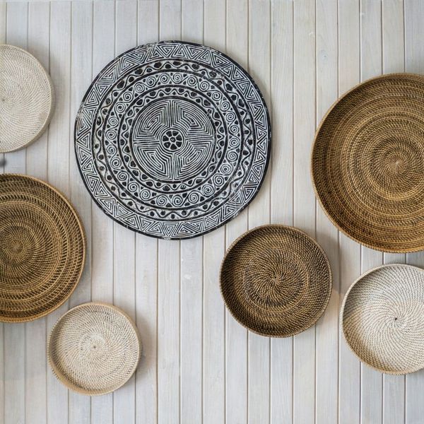 handmade wicker bowls on a wall