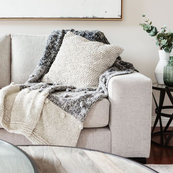 throw pillow and blankets on a couch