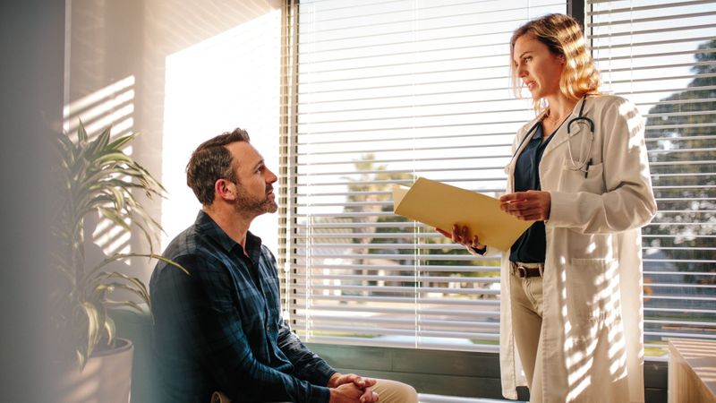 doctor speaking with patient