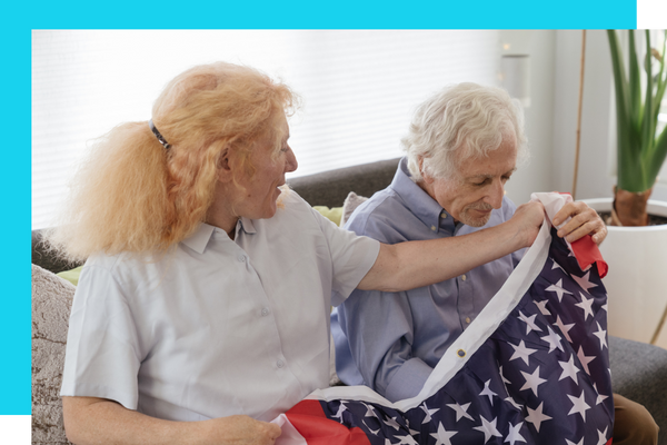 Old couple with an amercian flag