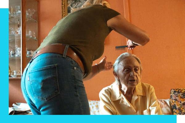 Elder getting her hair combed