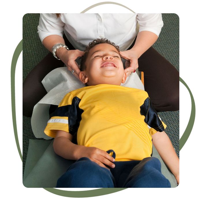 child receiving chiropractic adjustment