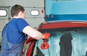 Image of a man working on auto glass