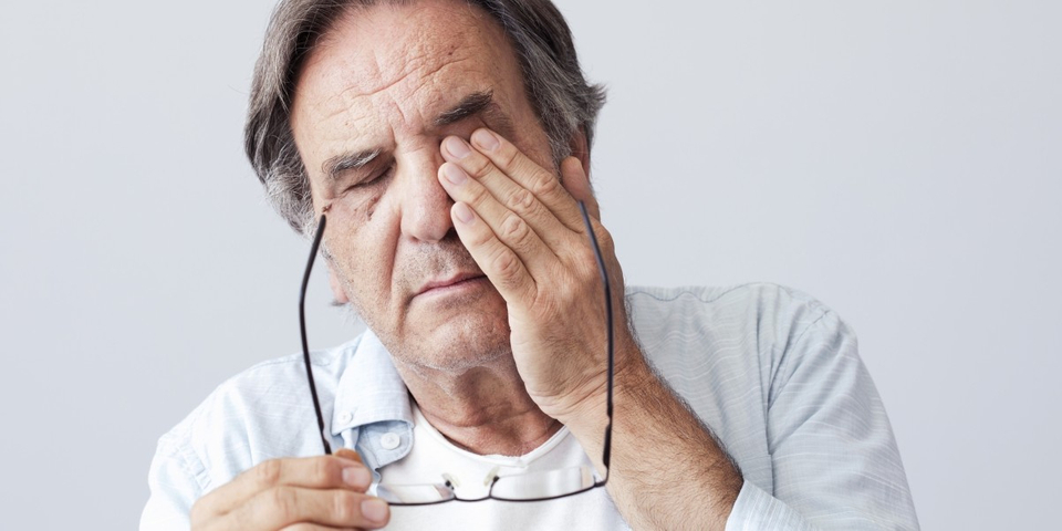 image of man with eye pain