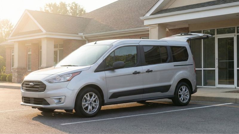 An accessible van parked in front of a medical clinic