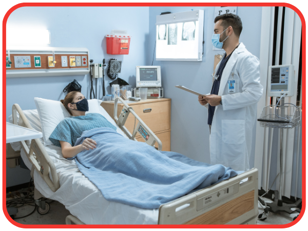 patient on hospital bed, talking to doctor