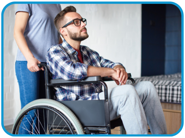man in a wheelchair getting pushed man in a wheelchair getting pushed
