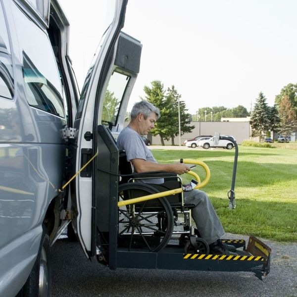 wheelchair being loaded into an accessible van