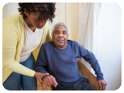 man getting help in an assisted living home