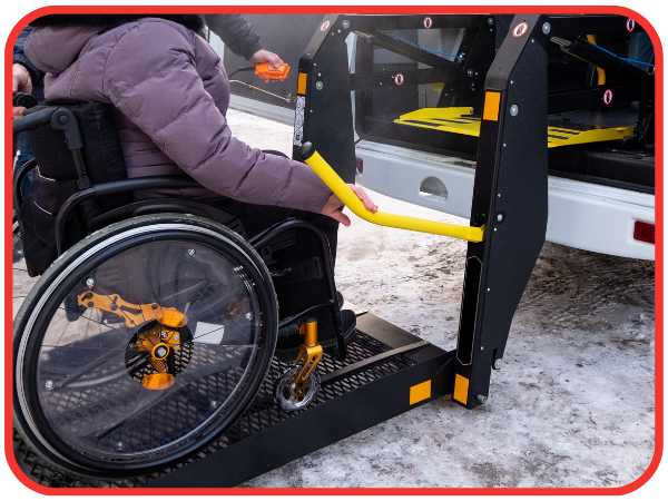 woman in a wheelchair getting loaded into a van woman in a wheelchair getting loaded into a van