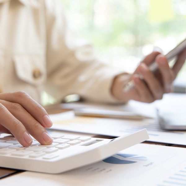 budgeting — calculator and phone with paperwork