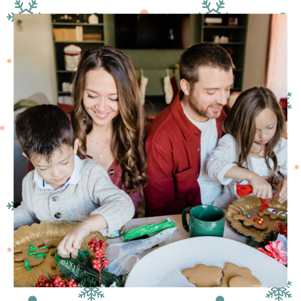 family decorating christmas cookies