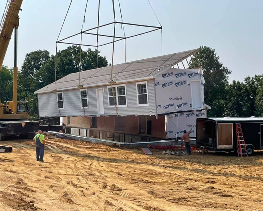 house being placed by crane