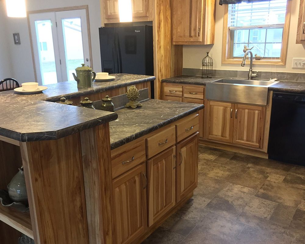 kitchen, natural wood cabinets and dark granite