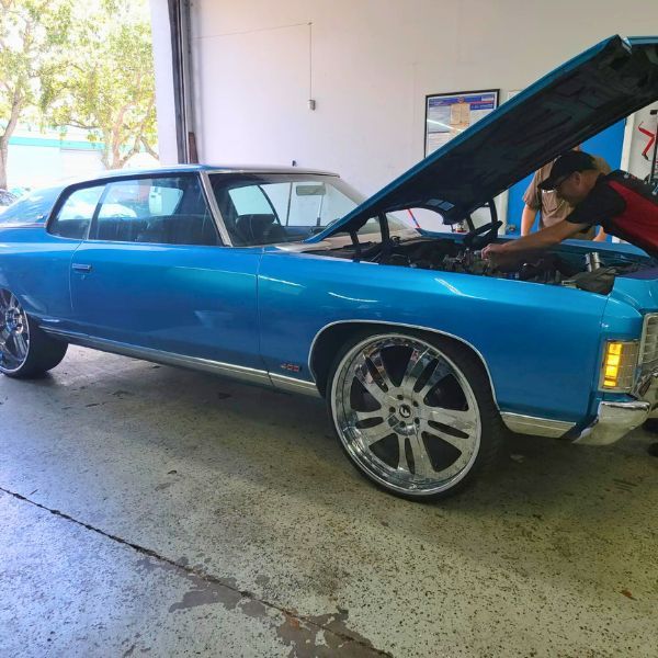 car in the Transmission Pro Davie shop being worked on