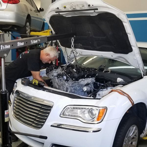 car in the Transmission Pro Davie shop being worked on