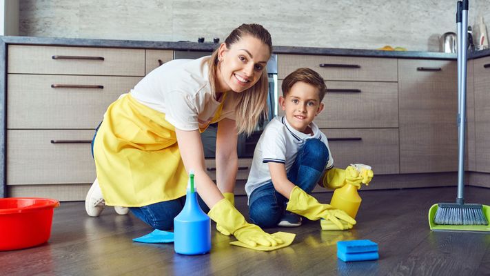 mom and son cleaning floor