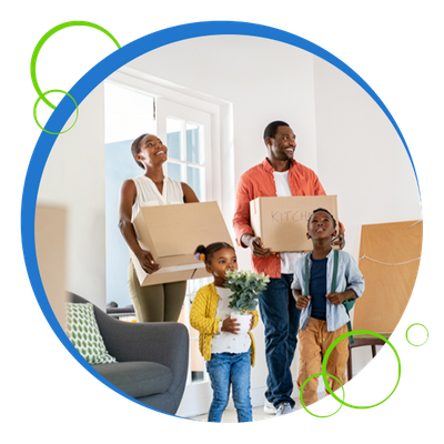 A family carrying boxes into their new home