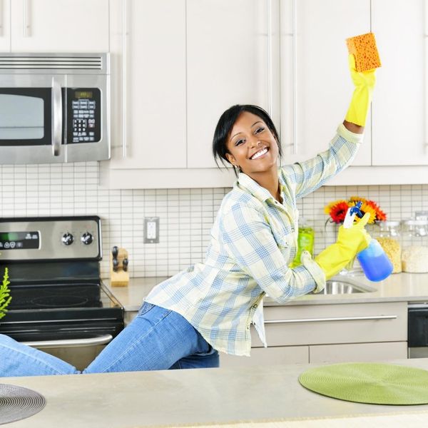 woman cleaning kitchen