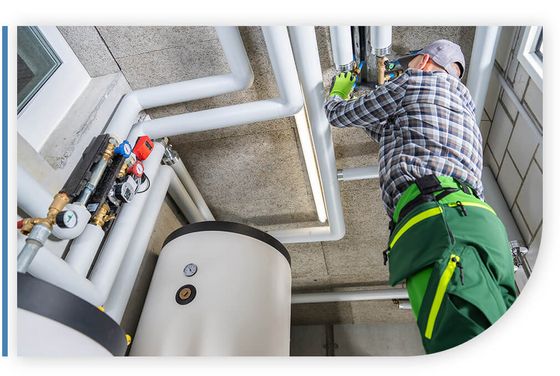 plumber working on pipes