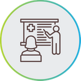 Line art icon showing an instructor pointing to a presentation board with a medical cross, enclosed in a blue and green circular border.