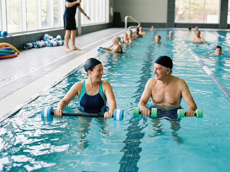 Senior Couple in Water Aerobics Class