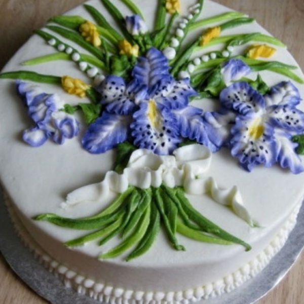 a cake decorated with iris flowers