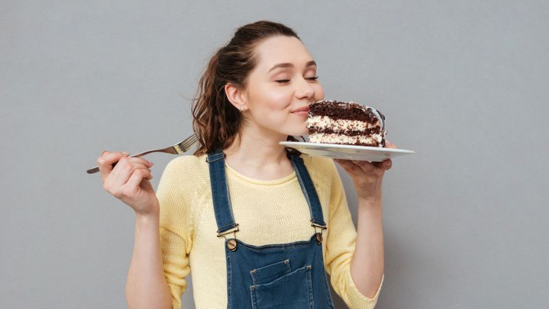 smiling woman with cake