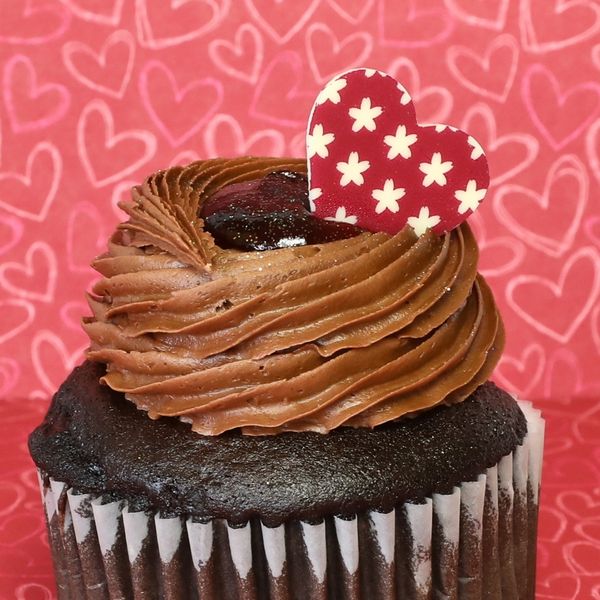 Chocolate cupcake with a heart and jam