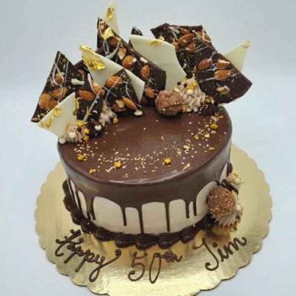 a chocolate cake with chocolate bark on top