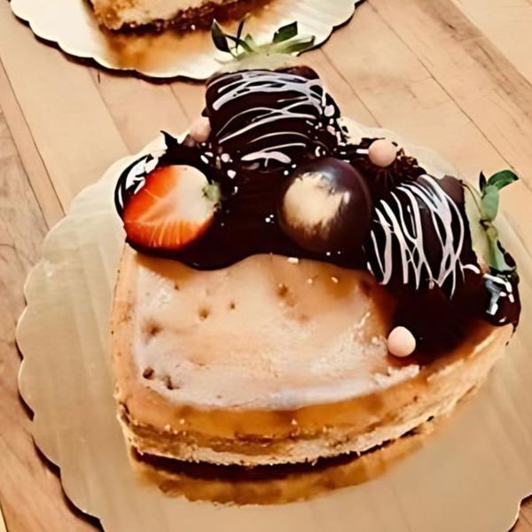 a heart cake with chocolate strawberries