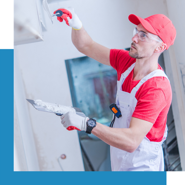 person installing drywall