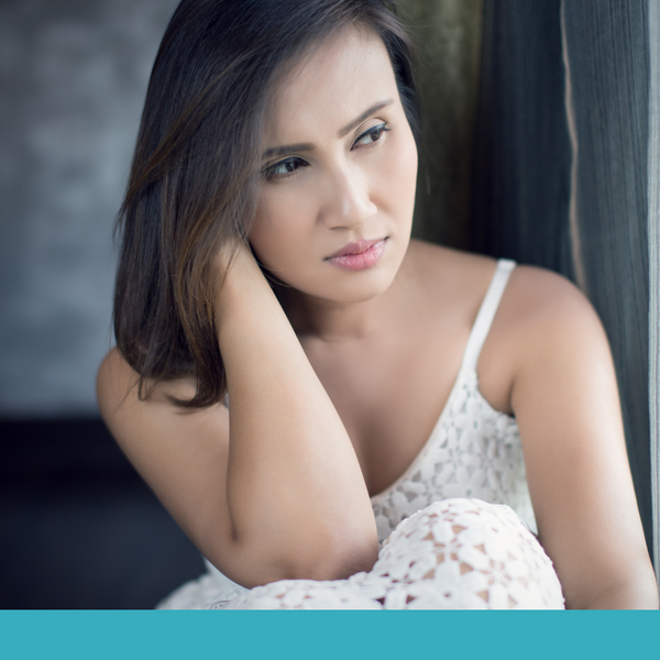 woman looking upset off to the side