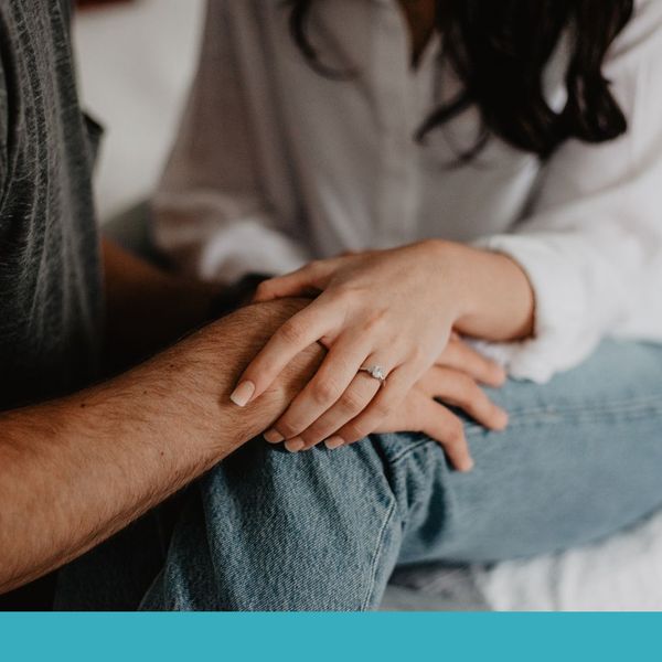husband and wife holding hands representing support