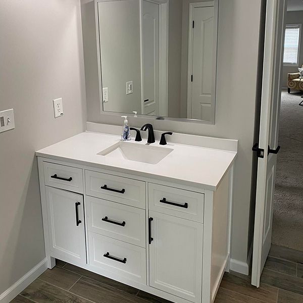 Vinyl plank flooring in white bathroom