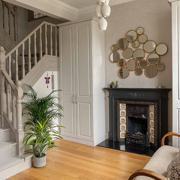 A gray fireplace in a modern designed living room