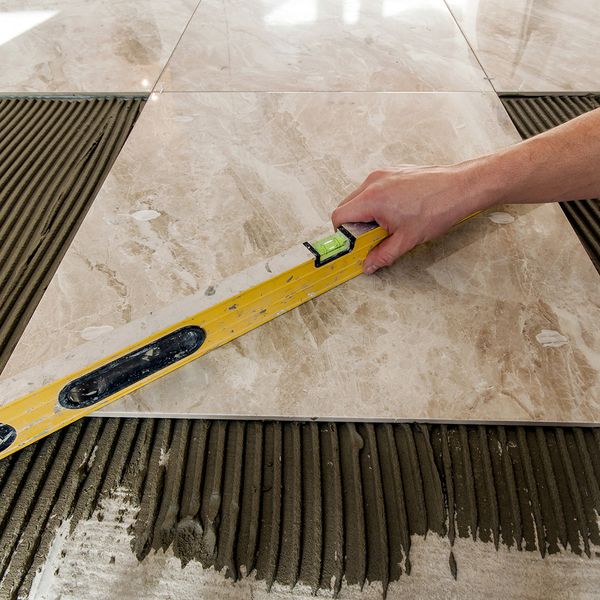 man setting tiles