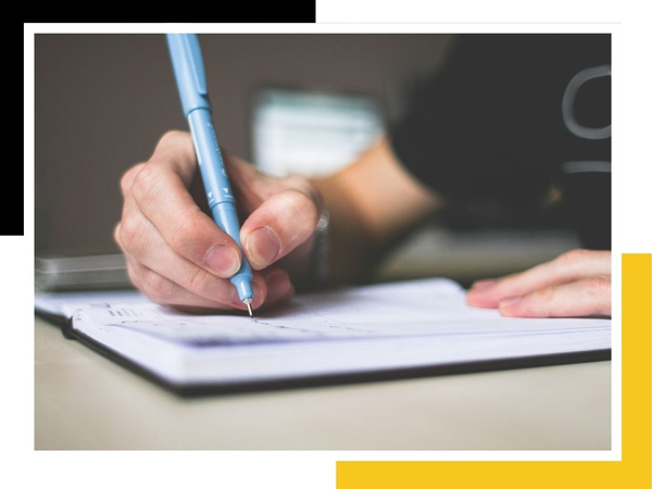 writing in notebook/planner