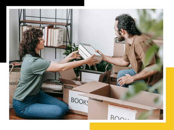 young couple boxing up books