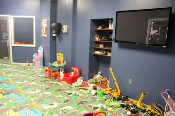 Club Metro USA kids' club room with toys and TV