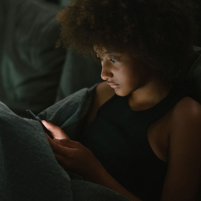 woman looking at phone at night woman looking at phone at night