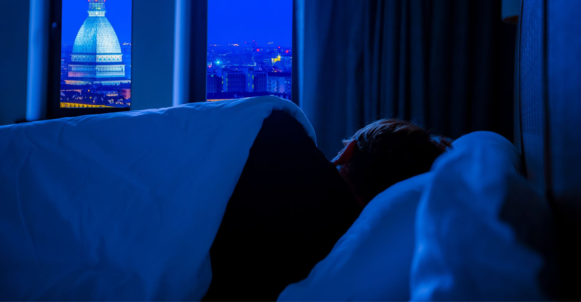 A woman asleep next to a window. A woman asleep next to a window.